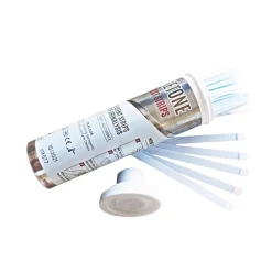 A container labelled Ketone Urine Test Strips DNX (100s) is open, with several white strips fanned out beside it and the cap in front. The label features text, symbols, and a barcode.