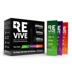 A black box of REVIVE Electrolytes is displayed with apple, blackcurrant, and blood orange sachets beside it. The packaging highlights hydration benefits and the presence of sodium, potassium, and magnesium.