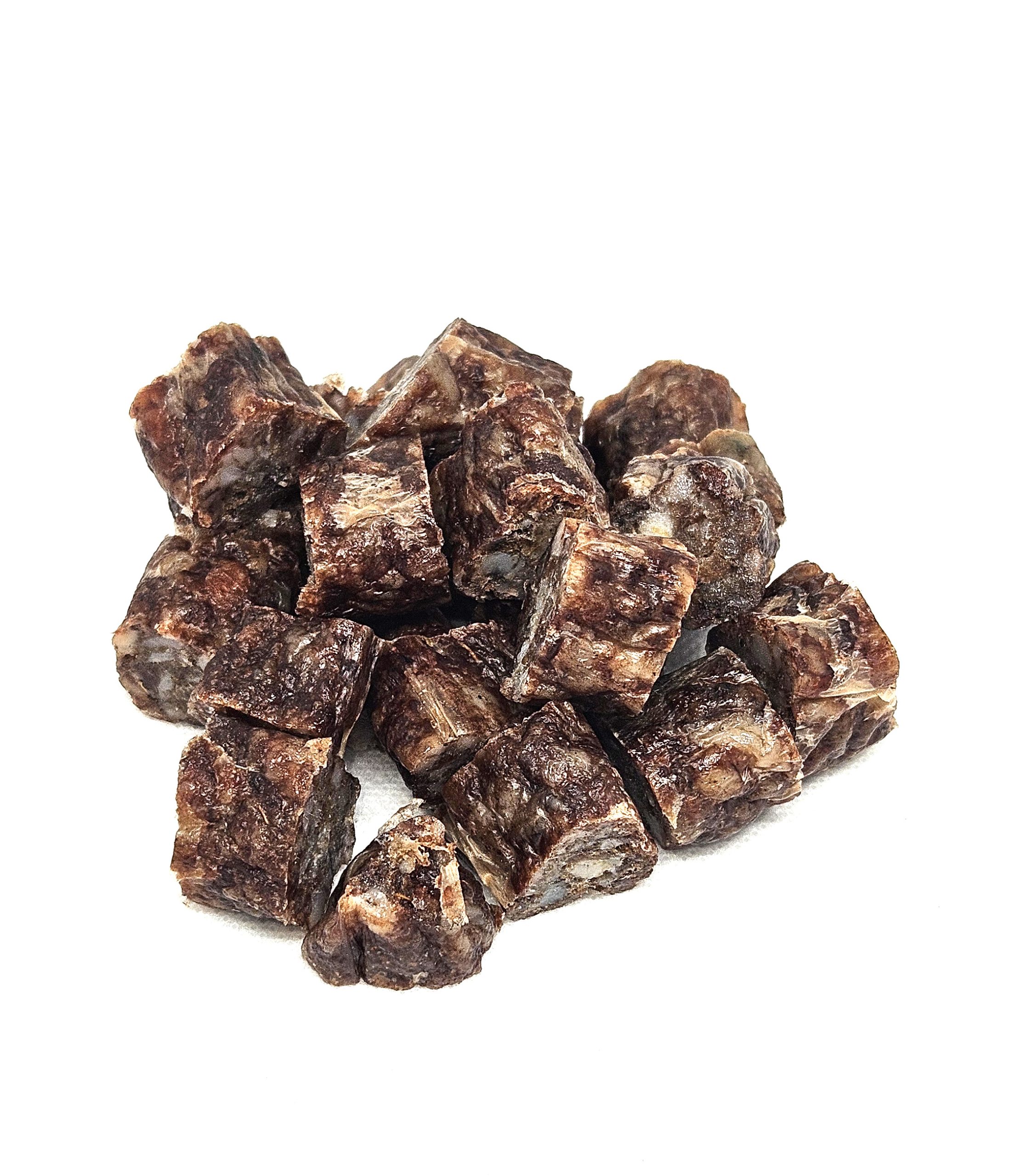 A pile of Droëwors, featuring small, dark brown cubes with a marbled texture, is arranged on a white background.