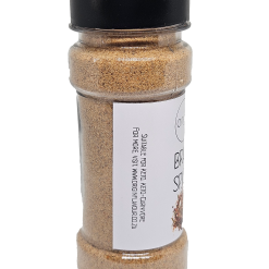 A clear plastic jar with a black lid, filled with brown Origin Braai Spice. The jar displays a white label with text, shown on a plain white background.