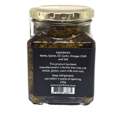 Origin Relish comes in a glass jar with a gold lid. The label lists herbs, spices, oil, garlic, vinegar, chilli, and salt as ingredients and provides allergen details and storage instructions. The relish is dark in colour.